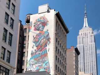 A Large Building With A Mural On It