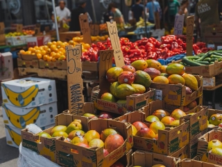 A Fruit Stand With Boxes Of Fruits
