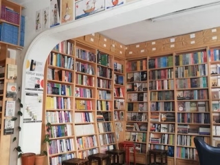 A Room With Bookshelves And Chairs