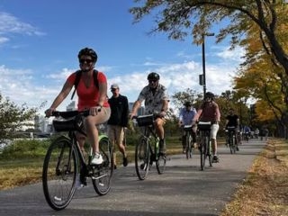 A Group Of People Riding Bikes