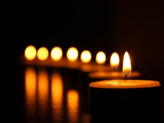 A Group Of Candles Lit